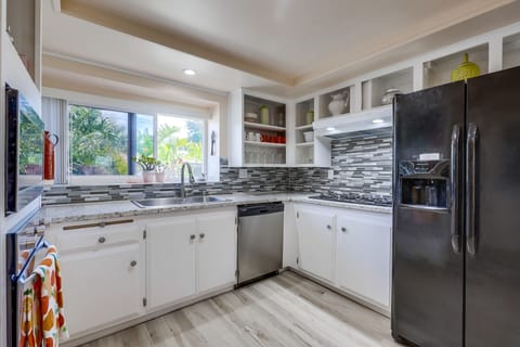Kitchen is fully stocked, cabinets are open so finding things is easy. 
