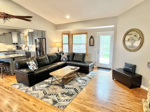 Plenty of comfy seating & side chairs to gather, easy access to rear deck & yard