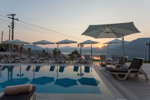 Seasonal outdoor pool, pool umbrellas, sun loungers