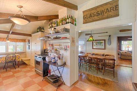 Kitchen on left looking into dining room and living room in distant right