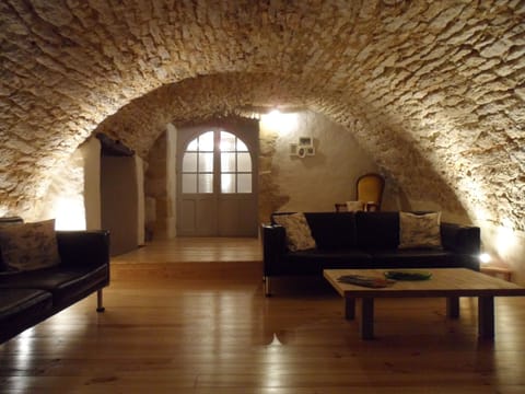 Unique vaulted lounge at night, which has views of the dordogne valley.