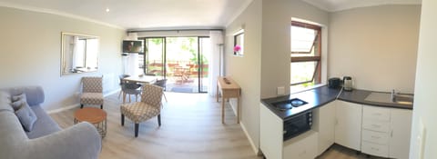 Family Apartment, Kitchen, Poolside | Living room | 32-inch flat-screen TV with satellite channels, TV