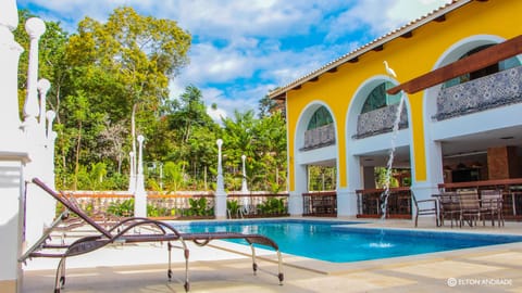 Outdoor pool, open 6:00 AM to 10:00 PM, pool umbrellas, sun loungers