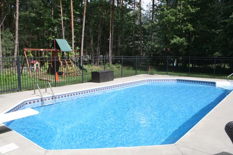 In-ground pool, tons of pool toys, backyard playground, and horseshoe pit