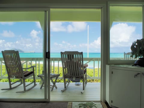 Living room to Lanai.  4 teak Rockers, 2 teak Steamer Chairs, 