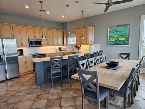 3rd floor kitchen - post renovation in 2025.  Table and bar seating for 15+.