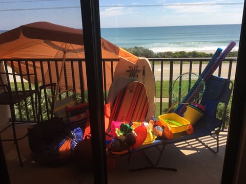 Beach toys, chairs, boogie boards, towels, cooler, charcoal grill, fishing poles