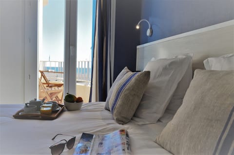 Standard Double Room, Partial Sea View | Iron/ironing board (on request), WiFi (free), bed sheets
