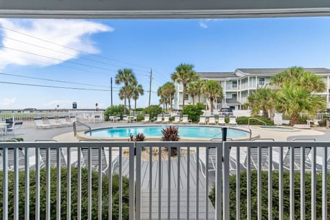 View of the heated pool and lounge chairs from the patio.