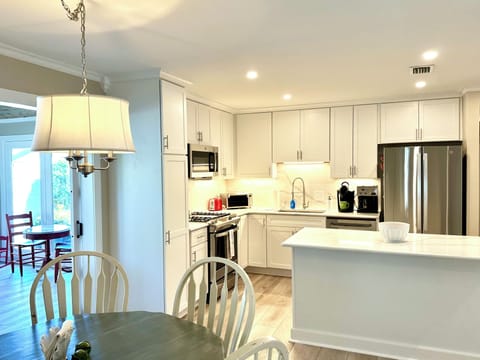View of Kitchen and Sunroom