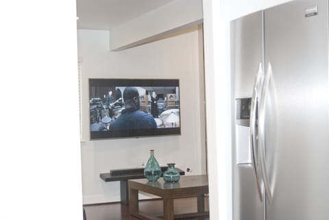 Watch the TV from the kitchen -  don't miss any of the action