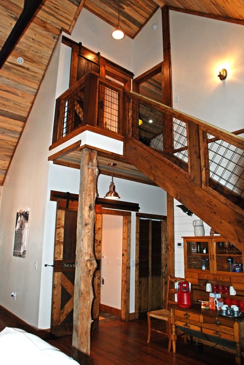 A timber from a 100 year old barn supports part of the second floor.  