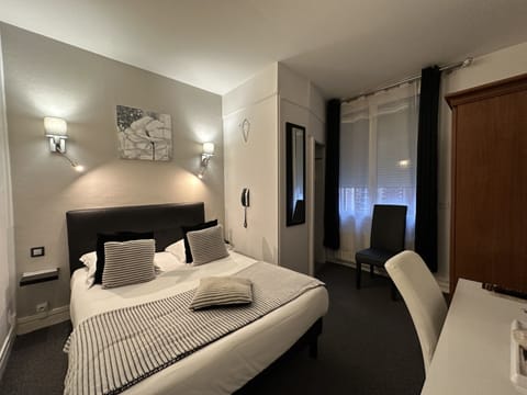 Standard Double Room | Minibar, in-room safe, desk, blackout drapes