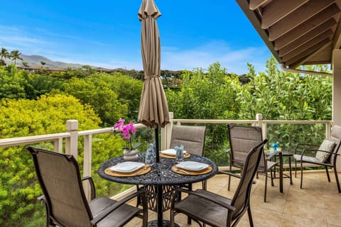 Relax on your private lanai overlooking lush tropical greenery—perfect for morning coffee or a peaceful outdoor meal