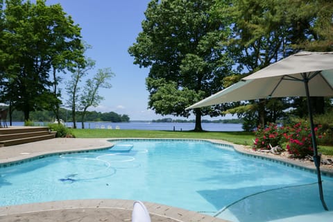 Baja Deck with umbrella- sit in pool on plastic adirondack chairs and read!  