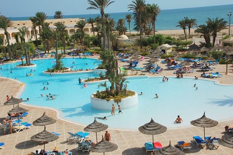 Indoor pool, 3 outdoor pools, open 6 AM to 7 PM, pool umbrellas