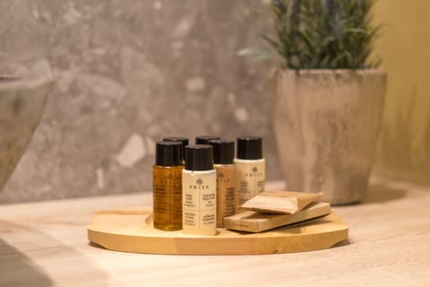 Designer toiletries, hair dryer, bathrobes, slippers