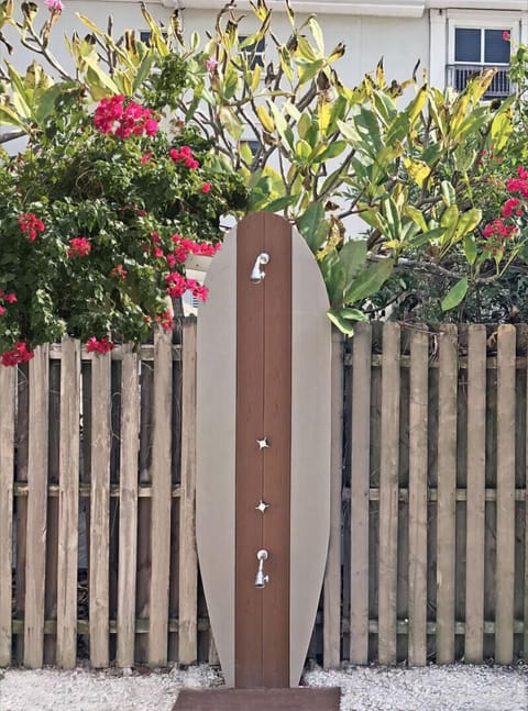 Outdoor shower for the complex great for rinsing off after the beach.