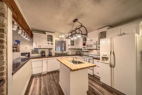 Spacious fully stocked kitchen with island.