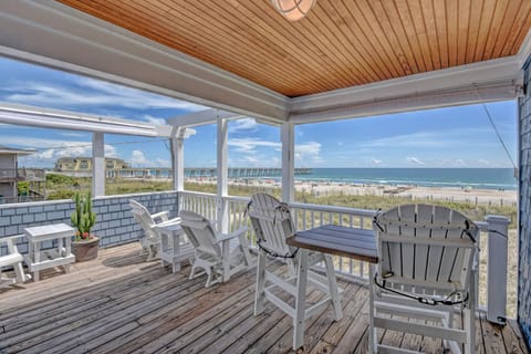 The spacious porch offers stunning views of the sunset