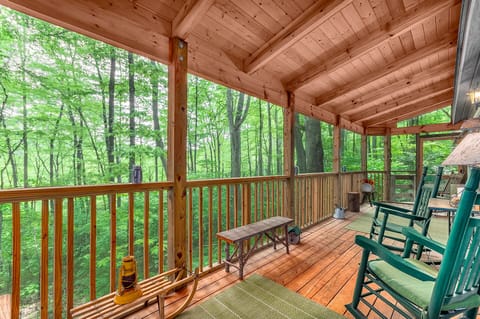 Incredible covered screen porch with rockers.