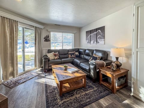 Living space with rustic charm, perfect for relaxing by the window after a day outdoors.