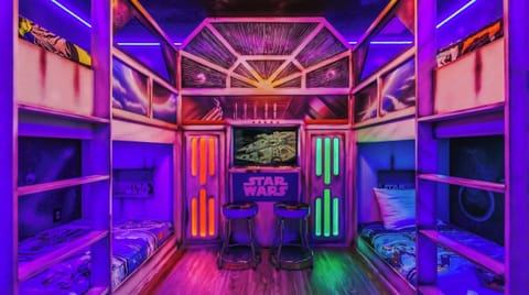 Upstairs bedroom featuring a cool Star Wars theme, creating an exciting and enjoyable space for kids.