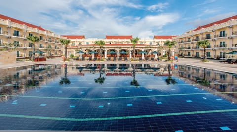 Outdoor pool, open 8 AM to 8 PM, pool umbrellas, sun loungers