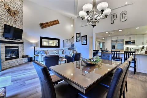 Open concept main level with huge ski run views with fireplace, HDTV & seating