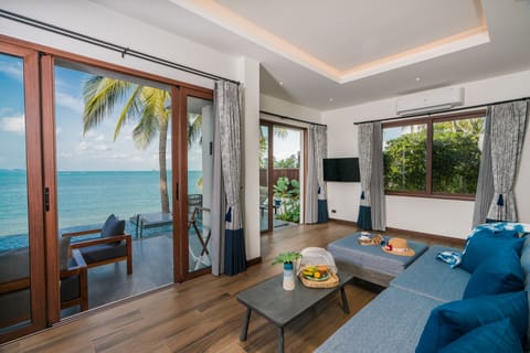 Two-Bedroom Beachfront Pool Villa | Living area | 43-inch LCD TV with satellite channels, TV