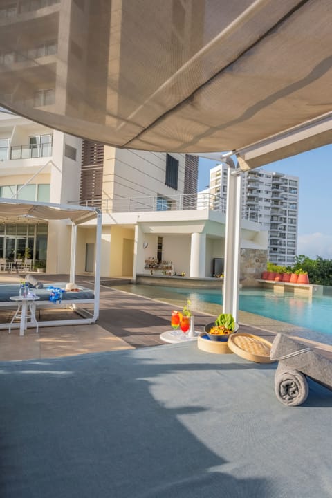 Outdoor pool, pool umbrellas, sun loungers