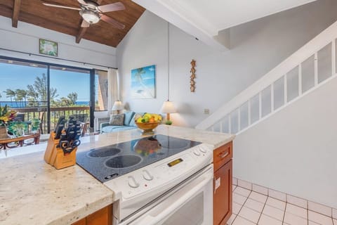 Prepare meals while staying connected with family in the adjoining living room and dining area