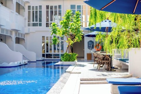 2 outdoor pools, pool umbrellas, sun loungers