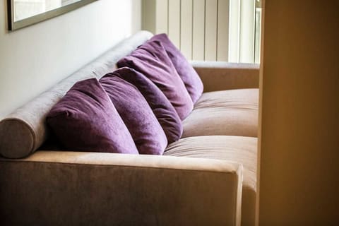 Suite, Jetted Tub, City View | Living area | 50-inch flat-screen TV with digital channels, TV