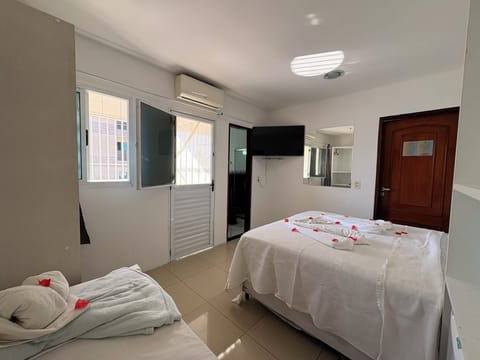 Basic Triple Room | Blackout drapes, iron/ironing board, free WiFi, bed sheets