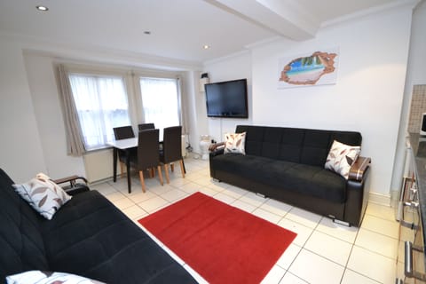 Apartment, 2 Bedrooms | Living room | Flat-screen TV