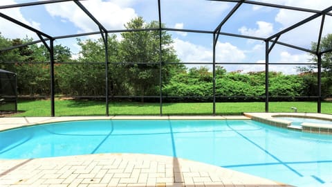 Year-round swimming: Screened pool for endless fun.