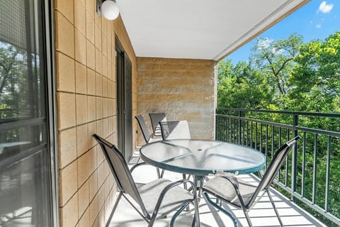 The private balcony is accessed from the main bedroom and living