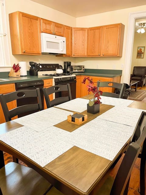 Charming eat-in kitchen with ample space for dining and meal prep.