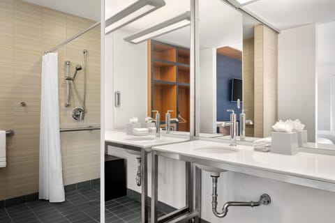 Shower, designer toiletries, hair dryer, towels