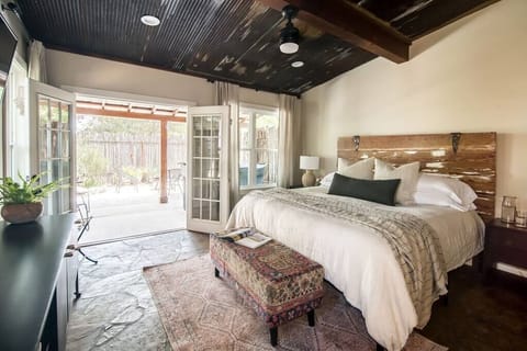 King bedroom with French doors opening to private courtyard