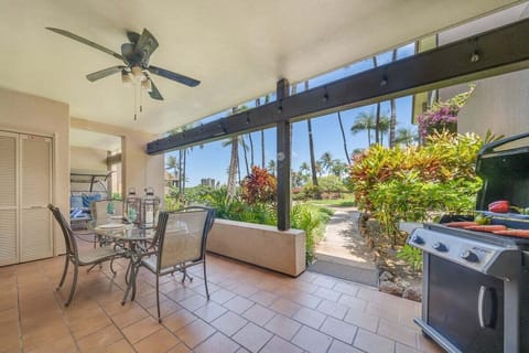 Inviting covered terrace with BBQ grill and scenic greenery for outdoor gatherings