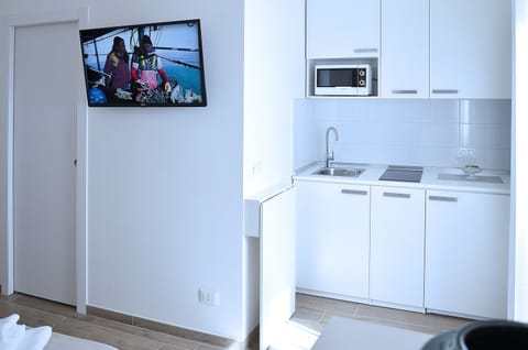 Suite, Balcony | Private kitchenette | Full-size fridge, microwave, stovetop, coffee/tea maker