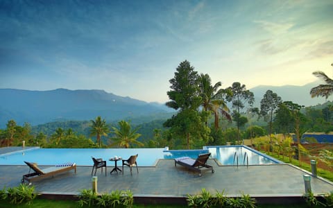 Outdoor pool, open 7:00 AM to 7:00 PM, pool umbrellas, sun loungers