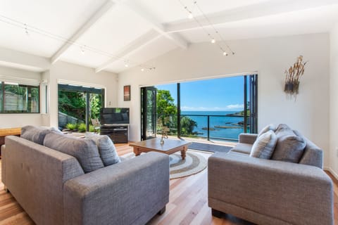 Beachfront Enclosure Bay | Living area | Flat-screen TV, DVD player