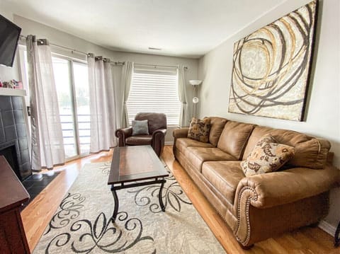 Bright living room with balcony access and abundant natural light