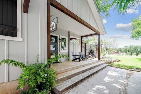 Front exterior of The Hideaway with private porch seating