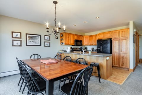 Large dining area and well stocked kitchen.