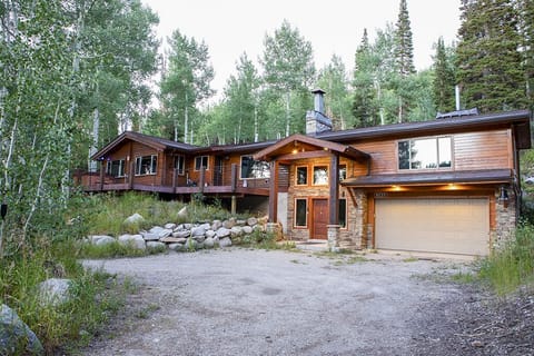 Exterior in Summer - Plenty of space for parking with 2 garage spots and a large driveway. Please do not park more than 3 cars in driveway in winter to allow room for plows.