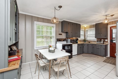 Dining area. Set with 4 chairs, additional in back BR closet.